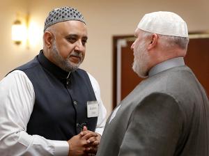Kareem Irfan talks with Kifah Mustapha before dinner during the 21st annual Catholic-Muslim iftar dinner at the Mecca Center in Willowbrook on May 25. (Karen Callaway/Chicago Catholic)