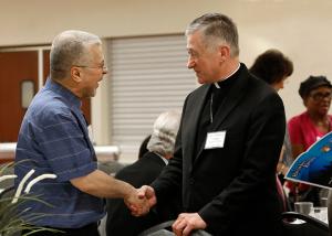 Chicago Cardinal Blase Cupich greets with Mohamad Jabri before dinner. (Karen Callaway/Chicago Catholic)