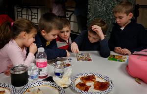 Children play Bible Bingo after the blessing. (Karen Callaway/Chicago Catholic)