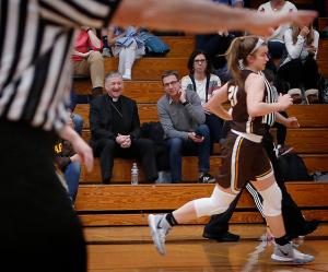 Cardinal Cupich laughs during the game. As part of Catholic Schools Week, Cardinal Cupich visited Fenwick High School in Oak Park to watch the Fenwick Friars take on the Carmel Corsairs from Mundelein on Jan. 31, 2020. (Karen Callaway/Chicago Catholic)