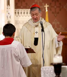 Cardinal Cupich prays during a Mass in celebration of Catholic Schools Week with students from St. Nicholas of Tolentine and Queen of the Universe Schools at St. Nicholas of Tolentine Church, 3741 W. 62nd St., on Jan.24, 2020. The two schools have been joining together in the spirit of Renew My Church on certain activities. (Karen Callaway/Chicago Catholic)
