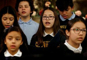 Members of the student choir sing the opening hymn. (Karen Callaway/Chicago Catholic)