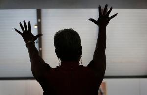 Eileen Foggie lifts her arms in praise. (Karen Callaway/Chicago Catholic)