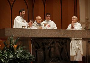 Father Matt Alexander elevates the cup as Archbishop Emeritus of Assisi Domenico Sorrentino elevates the paten during Mass at Holy Name Cathedral on Sept. 9, 2026. The archbishop brought relics of St. Francis of Assisi, St. Clare of Assisi and St. Carlo Acutis to the archdiocese for a week-long visit to parishes, schools and shrines. The visit marked the Jubilee Year of St. Francis and the first anniversary of St. Carlo Acutis’ canonization. People venerated the relics following Mass. (Karen Callaway/Chicago Catholic)