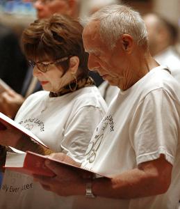 Wearing matching 50th anniversary T-shirts, John and Josephine Gullo from Our Lady of Ransom Parish in Niles, sing during Mass. Cardinal Cupich was the main celebrant at a Mass for couples celebrating 50 years of marriage at Holy Name Cathedral, 735 N. State St., on Sept. 13, 2026. More than 300 couples attended with their families to renew their vows during the Mass. (Karen Callaway/Chicago Catholic)