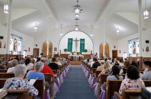 The altar is prepared during Mass at St. Hugh. (Karen Callaway/Chicago Catholic)