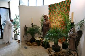 The bronze statue of Our Lady of Africa is enshrined in the church narthex. A Corpus Christi parishioner commissioned the statue and donated it to the church 25 years ago. It was moved to the Holy Angels worship site prior to the inaugural Mass. (Karen Callaway/Chicago Catholic)