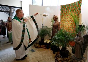 Kelly incenses the statue of Our Lady of Africa prior to the start of the inaugural Mass. (Karen Callaway/Chicago Catholic)