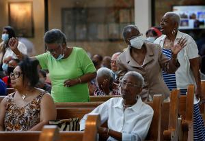 Worshipers dance to the sacred music at the end of Mass. (Karen Callaway/Chicago Catholic)