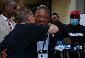 Pfleger embraces Rev. Jesse Jackson. (Karen Callaway/Chicago Catholic)
