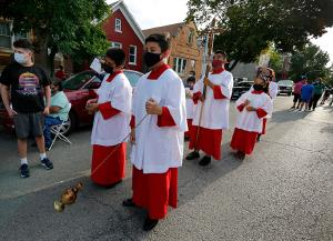 Altar servers lead the opening procession for the street Mass. (Karen Callaway/Chicago Catholic)