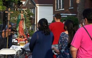 Statues of Our Lady of Guadalupe and Divina Niño that would be blessed after Mass are on display next to the altar. (Karen Callaway/Chicago Catholic)