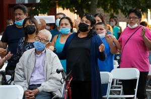 Members of the congregation hold hands during the Our Father. (Karen Callaway/Chicago Catholic)