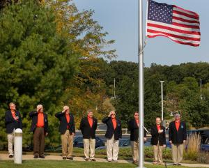Members of the Knights of Columbus salute as the flag is lowered to half-staff. (Karen Callaway/Chicago Catholic)
