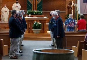 Members of the Knights of Columbus line the aisle at the end of Mass. (Karen Callaway/Chicago Catholic)