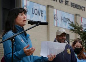 Principal Jennifer Farrand kicks off the march. (Karen Callaway/Chicago Catholic)