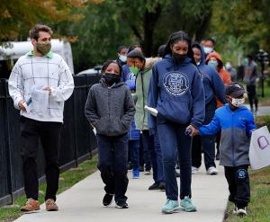 Teachers and volunteers joined students in the walk. (Karen Callaway/Chicago Catholic)