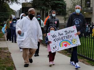Teachers and volunteers joined students in the walk. (Karen Callaway/Chicago Catholic)