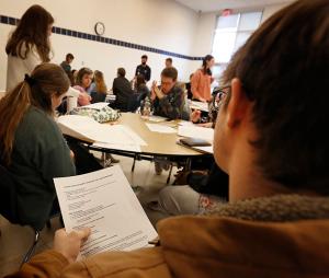 Students brainstorm on how best to deliver their message on the climate emergency. (Karen Callaway/Chicago Catholic)