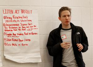 Dillan Chuby, a sophomore at St. Viator, gives a presentation of solutions to combat climate change from his break-out group. (Karen Callaway/Chicago Catholic)