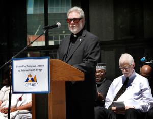 Father Baima joins interfaith leaders for a prayer service led by the Council of Religious Leaders of Metropolitan Chicago at Daley Plaza on July 19, 2016. (Karen Callaway/Chicago Catholic)
