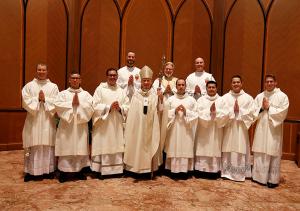 Father Baima poses with Cardinal Cupich and permanent and transitional deacons on May 11, 2019 at Holy Name Cathedral, following the deacons’ ordinations. (Karen Callaway/Chicago Catholic)