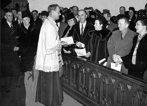THEN: Couples married 25 years or more renew their marriage vows at Holy Name Cathedral on March 22, 1947. Msgr. Patrick Hayes, pastor, congratulates (left) Mr. and Mrs. John F. Walsh of St. Cyril Parish and (right) Capt. and Mrs. Paul V. Pallasch of St. John Berchmans Parish. (Chicago Catholic file photo)