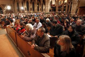 NOW: worshippers pack the cathedral for Midnight Mass in 2014. (Chicago Catholic file photo)
