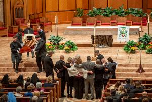 Members of Bishop Birmingham’s family gather at the casket before it was closed for the start of the funeral Mass on Oct. 7, 2023 at the cathedral. Survivors include his mother Jeanette A. Birmingham and his siblings Gary Birmingham, Jeanne Williams, Joleen Fields, Donna Green, Matt Birmingham, Theresa Gill, Mark Birmingham and Brandon Birmingham. He was uncle of 23 nephews and nieces and great uncle of many. (Deacon Randy Belice/Chicago Catholic)