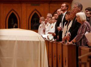 Members of Bishop Birmingham’s family pray at the start of the funeral Mass. (Karen Callaway/Chicago Catholic)