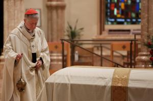 Cardinal Cupich incenses the casket during the concluding rite. “He made unity in the church and in the human family a priority, unafraid to step into the fray and call for calm,” Cardinal Cupich said. “And so it is, even in death, he brings us together this day, his parting gift to us, to remind us how fragile we all are, how much we need each other, how much we need to pay attention to what really counts, lest we overcomplicate our lives.” (Karen Callaway/Chicago Catholic)
