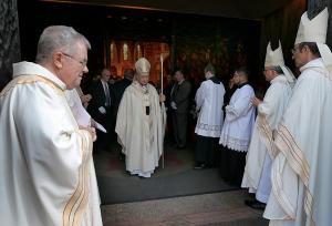 Left, Father William Corcoran, interim vicar; Bishop Robert Casey; and Bishop Mark Bartosic wait to join Cardinal Cupich outside the cathedral following the funeral Mass on Oct. 7, 2023. (Karen Callaway/Chicago Catholic)