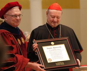 Loyola president Jesuit Father Michael Garanzini presents an honorary doctorate to Cardinal Ravasi. (Karen Callaway/Catholic New World)