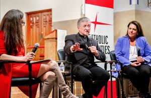 Cardinal Cupich responds to a question from Sally Blount, left, president and CEO of Catholic Charities of the Archdiocese of Chicago as Kerry Alys Robinson, CEO, Catholic Charities USA, looks on. They took part in a discussion on the theme “Imagining Abundance: Faith, Hope, and Charity in Today’s World” about the intersection of social justice and the mission of charity at St. Joseph Church in Wilmette on May 16, 2024. (Natalie Battaglia/Catholic Charities)