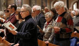 Participants sing during the opening of the event. (Karen Callaway/Chicago Catholic)