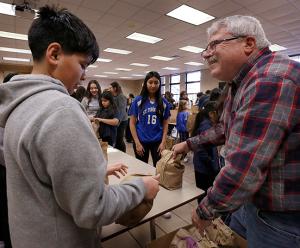 A volunteer talks to a student. (Karen Callaway/Chicago Catholic)