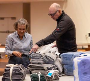 Nancy Giacalone and Terry Scully sort donations.  (Denise Duriga/Chicago Catholic)