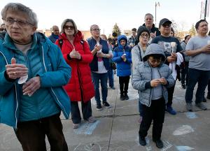 Families joined students in a candlelight vigil outside the school. (Karen Callaway/Chicago Catholic)