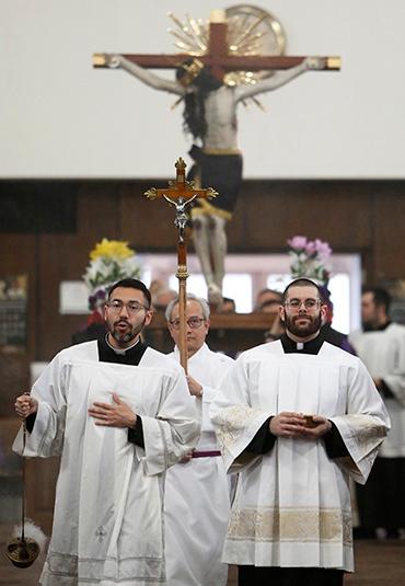 Juan Pablo Macias and Luis Delgado Robles lead the procession into church. Auxiliary Bishop Tim O’Malley gathered for Mass with parishioners and visiting priests for a celebration of the third anniversary of the arrival of a 1.45-meter replica of “Senor
del Amparo” (Lord of Protection) statue at Santa Maria de Popolo Parish in Mundelein on March 30, 2025. They also dedicated a new chapel that will house the statue permanently following Mass. The original statue is in Michoacan, Mexico. (Karen Callaway/Chicago Catholic)