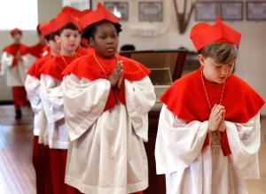 Students from Our Lady of Mount Carmel Academy, 720 W. Belmont Ave., take part in a mock papal conclave on May 6, 2025. Students took the rolls of cardinals in the conclave and acted out the various parts of the process to elect a new pope. The rest of the student body portrayed the crowds in St. Peter's square and were there when a new pope was announced. Students elected fourth-graders Augie Wilk on the third ballot and he took the name of Pope Augustine. (Karen Callaway/Chicago Catholic)
