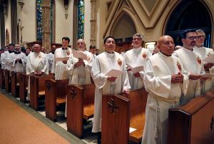 Priests listen to the cardinal speak before the final blessing.  (Karen Callaway/Chicago Catholic)
