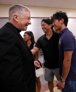 Cardinal Cupich greets people at a reception following Mass in the hall next to the cathedral. (Karen Callaway/Chicago Catholic)