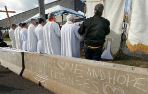 Priests pray the Our Father. (Karen Callaway/Chicago Catholic)