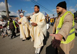 Bishop Maldonado leads other clergy to talk to law enforcement about distributing Communion to detainees. (Karen Callaway/Chicago Catholic)